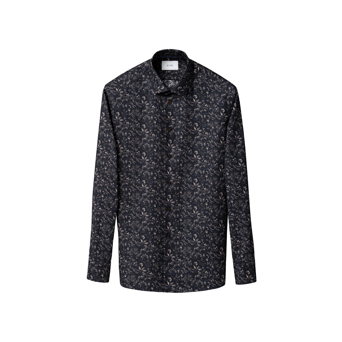 A long-sleeve button-up shirt with a dark charcoal and black base, covered in a dense, small-scale white and light grey abstract floral or leaf print, shown against a plain white background. Eton Shirt available at Sakks Menswear in Southampton.