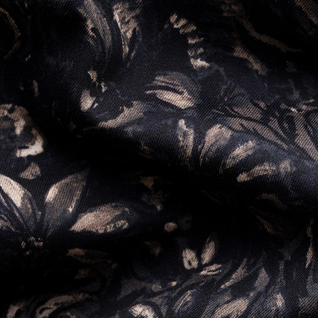 Black sheer lace fabric with a metallic gold floral and leaf pattern, shown in soft folds. Eton Shirt available at Sakks Menswear in Southampton.