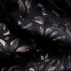 Black sheer lace fabric with a metallic gold floral and leaf pattern, shown in soft folds. Eton Shirt available at Sakks Menswear in Southampton.