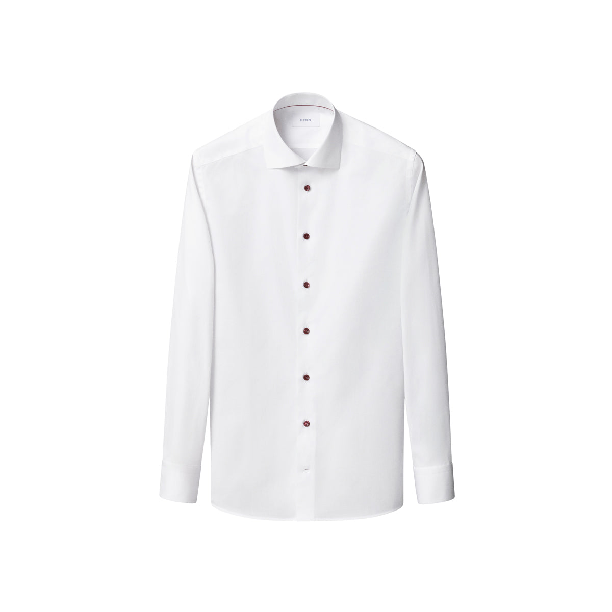 White shirt with burgundy coloured buttons sitting in front of a crisp white background. Eton shirt available at Sakks Menswear in Southampton.