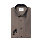 A folded brown dress shirt with a pointed collar, dark buttons, and a black patterned inner collar and pocket square, shown on a plain white background. The neck label reads ETON. Eton Shirt available at Sakks Menswear in Southampton.