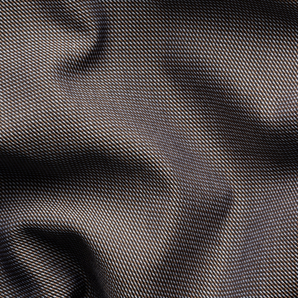 A close-up of dark charcoal grey fabric with a fine woven texture and soft folds. Eton Shirt available at Sakks Menswear in Southampton.