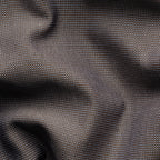 A close-up of dark charcoal grey fabric with a fine woven texture and soft folds. Eton Shirt available at Sakks Menswear in Southampton.