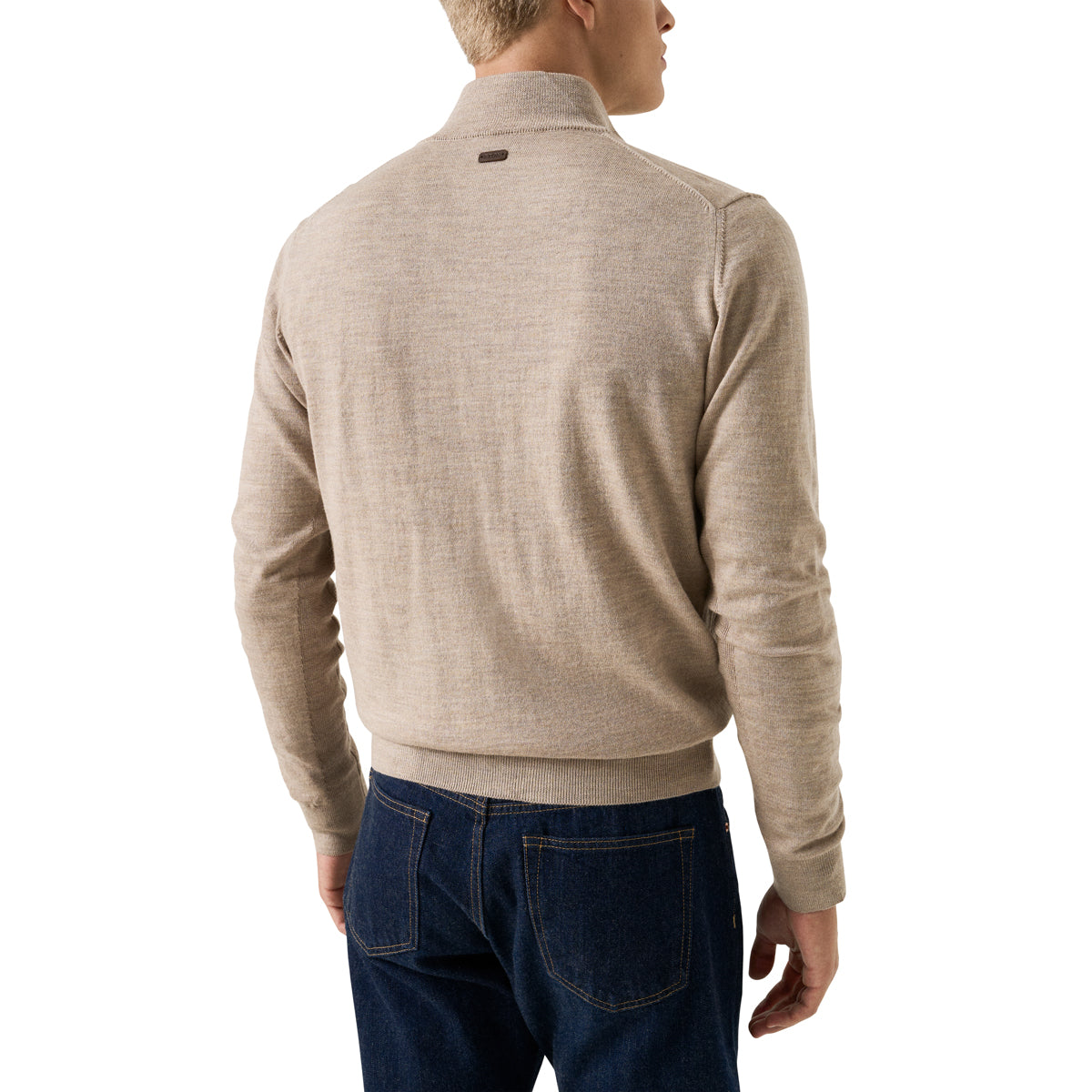 A man shown from the back wearing a light beige knit quarter-zip sweater and dark blue jeans, photographed against a plain white background. Eton Cardigan available at Sakks Menswear in Southampton.