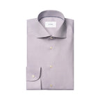 A light lavender dress shirt by ETON, neatly folded to show the collar, front buttons, and single-button cuff, on a solid white background. Eton Shirt available at Sakks Menswear in Southampton.