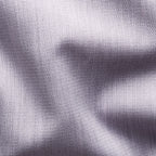 Close-up of a textured knit fabric in a light lavender-grey colour, showing the detailed weave and soft folds. Eton Shirt available at Sakks Menswear in Southampton.