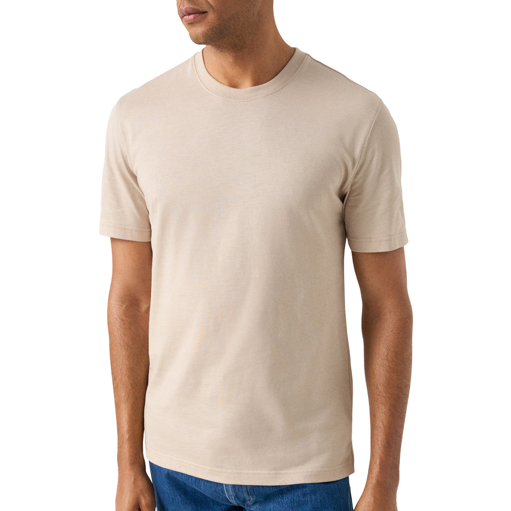 A man wearing a plain beige crew-neck short-sleeve t-shirt, shown from the chin down against a clean white background. Eton T-Shirt available at Sakks Menswear in Southampton.