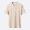 A light beige crewneck short-sleeve t-shirt displayed flat against a light grey background. Eton T-Shirt available at Sakks Menswear in Southampton.