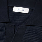 Navy blue textured fabric with Eton label. Eton Polo available at Sakks Menswear in Southampton.
