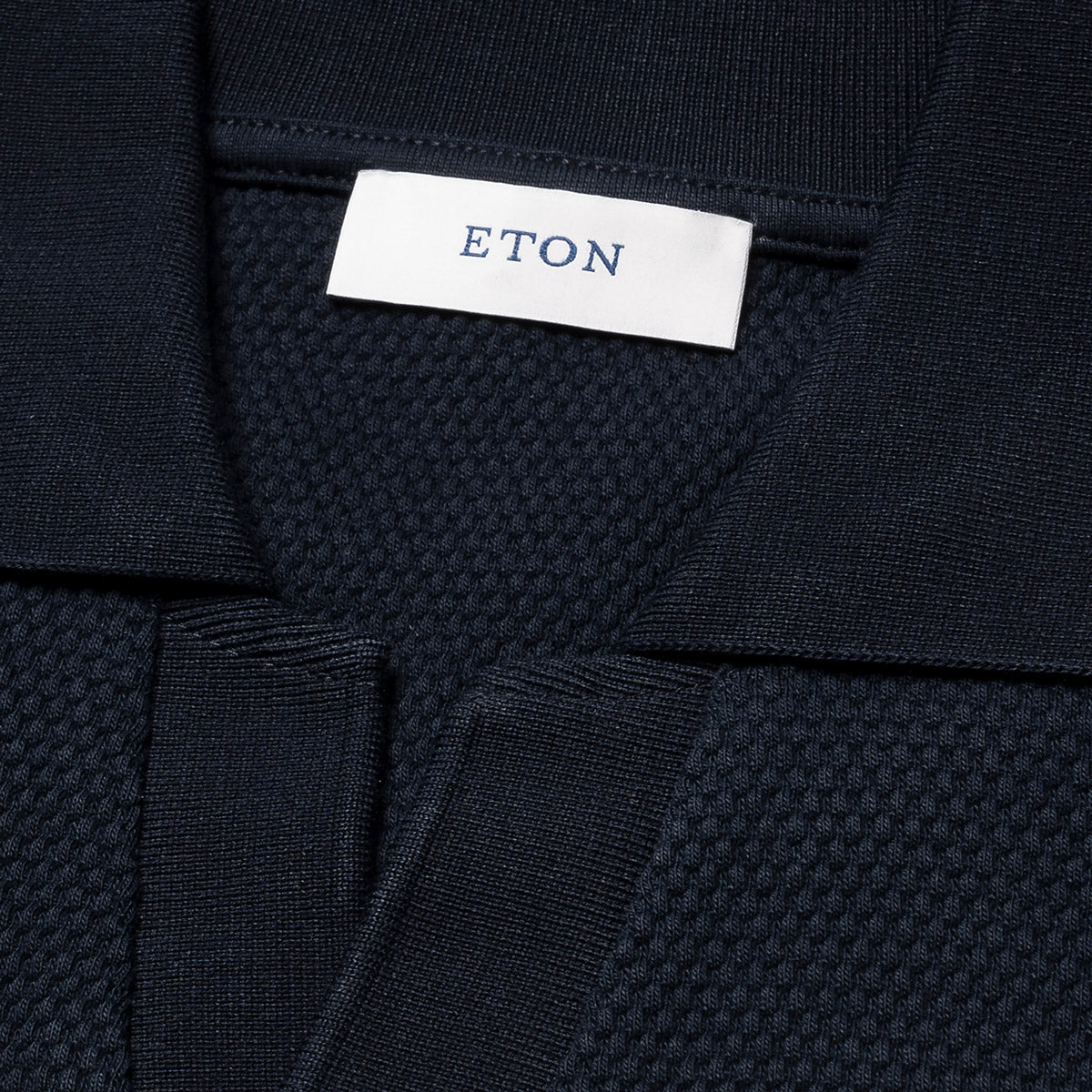 Navy blue textured fabric with Eton label. Eton Polo available at Sakks Menswear in Southampton.