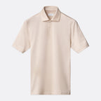 A light beige short-sleeve polo shirt with a classic collar and a two-button placket, displayed flat against a light grey background. Eton Polo Available at Sakks Menswear in Southampton.