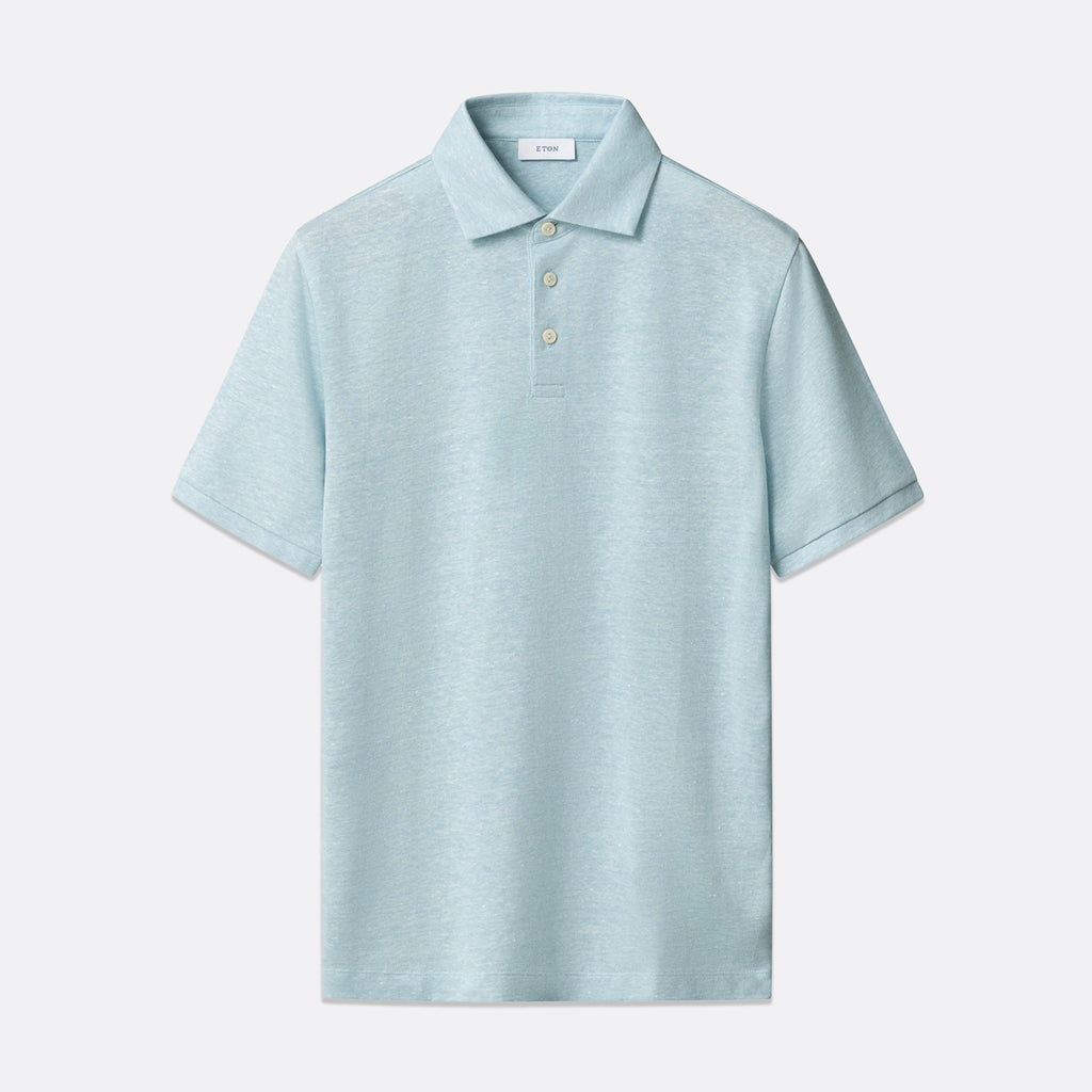 A light blue short-sleeve polo shirt with a three-button placket, displayed on a clean, light gray background. Eton Polo. Sakks Menswear Southampton.