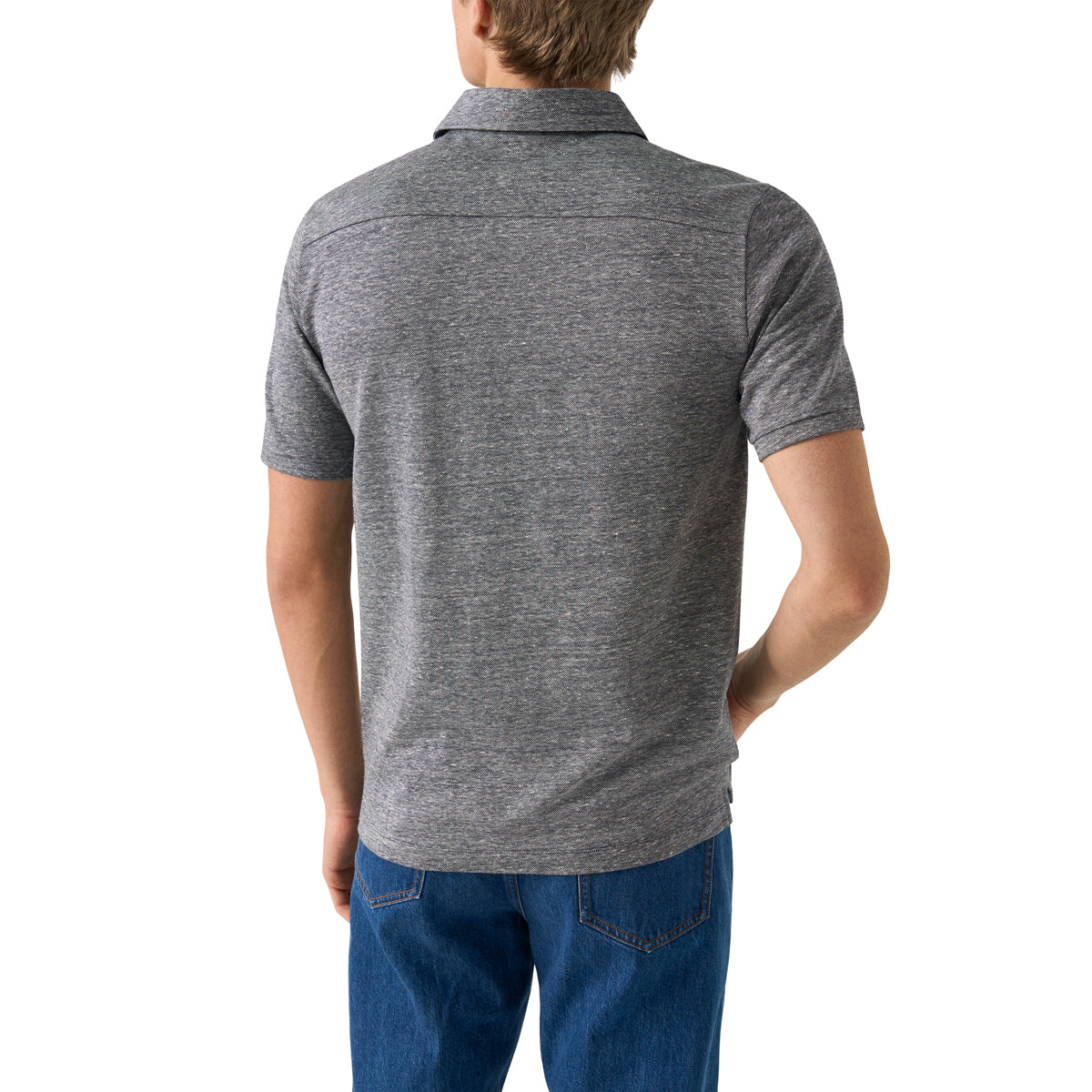 A man viewed from the back wearing a heather grey short-sleeve polo shirt and blue jeans, set against a plain white background. Eton Polo. Sakks Menswear Southampton.