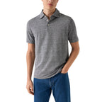 A man wearing a short-sleeve heather grey polo shirt with blue jeans, shown from the waist up against a plain white background. Eton Polo. Sakks Menswear Southampton.