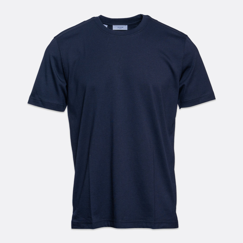 A classic short-sleeve crewneck t-shirt in dark navy blue, shown flat against a light gray background. Eton T-Shirt. Sakks Menswear Southampton.