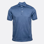 A short-sleeve polo shirt in a heathered medium blue color, featuring a three-button placket and a classic collar, displayed on a light gray background. Eton Polo Shirt. Sakks Menswear Southampton.