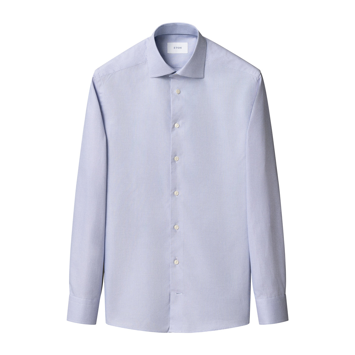 A light blue long-sleeve dress shirt with a spread collar and white buttons, shown flat against a solid white background. Eton Shirt. Sakks Menswear Southampton.
