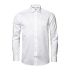 A white long-sleeve dress shirt with a classic collar and button-down front, shown on a clean white background. Eton Shirt. Sakks Menswear Southampton.