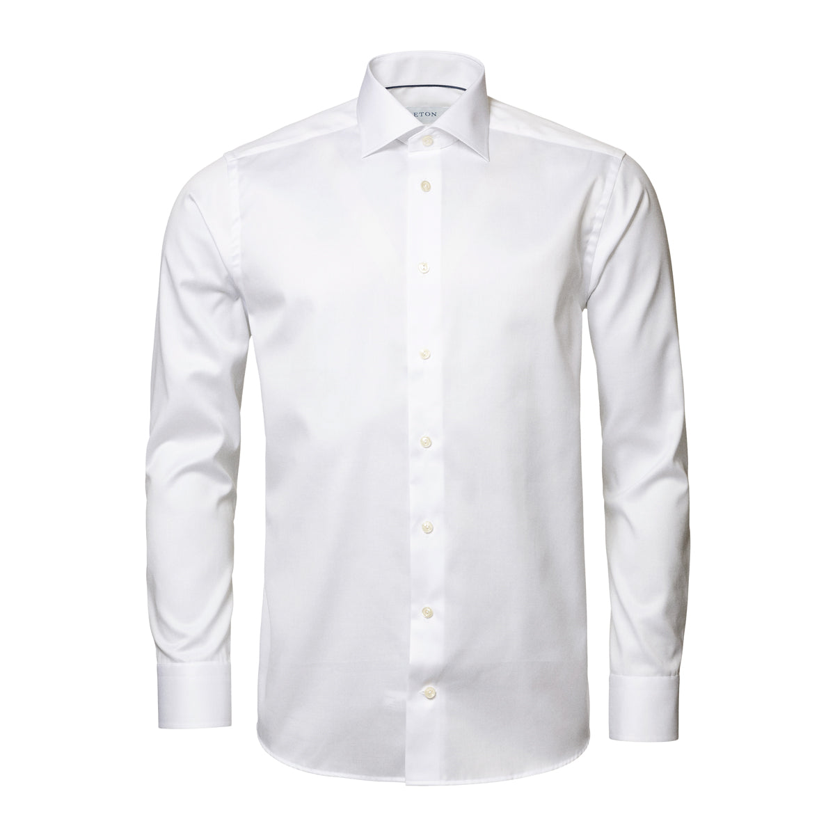 A white long-sleeve dress shirt with a classic collar and button-down front, shown on a clean white background. Eton Shirt. Sakks Menswear Southampton.