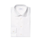 A folded white long-sleeve dress shirt with a pointed collar, button-down front, and a single-button cuff, shown on a plain white background. The neck label reads ETON. Eton Shirt. Sakks Menswear Southampton.