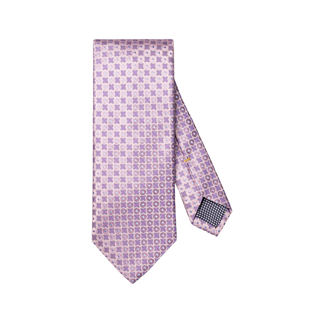A lavender and purple patterned silk necktie with a repeating geometric design, displayed flat against a solid white background. Eton Ties available at Sakks Menswear in Southampton.