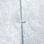 Close-up of a light blue and white patterned fabric with a central vertical seam and a small button closure. Eton Ties available at Sakks Menswear in Southampton.