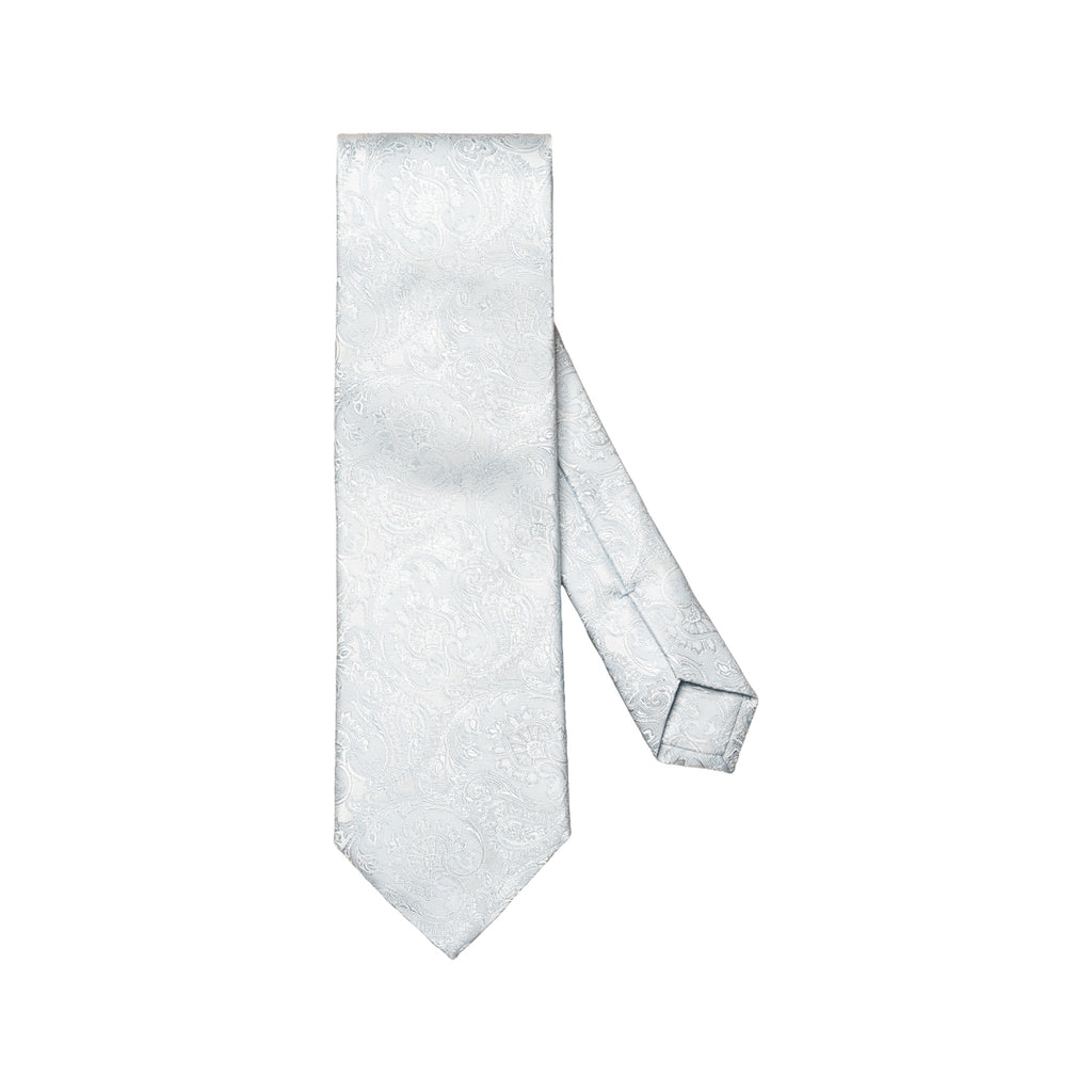 A light silver necktie with a subtle woven paisley pattern, displayed on a clean white background. Eton Ties available at Sakks Menswear in Southampton.