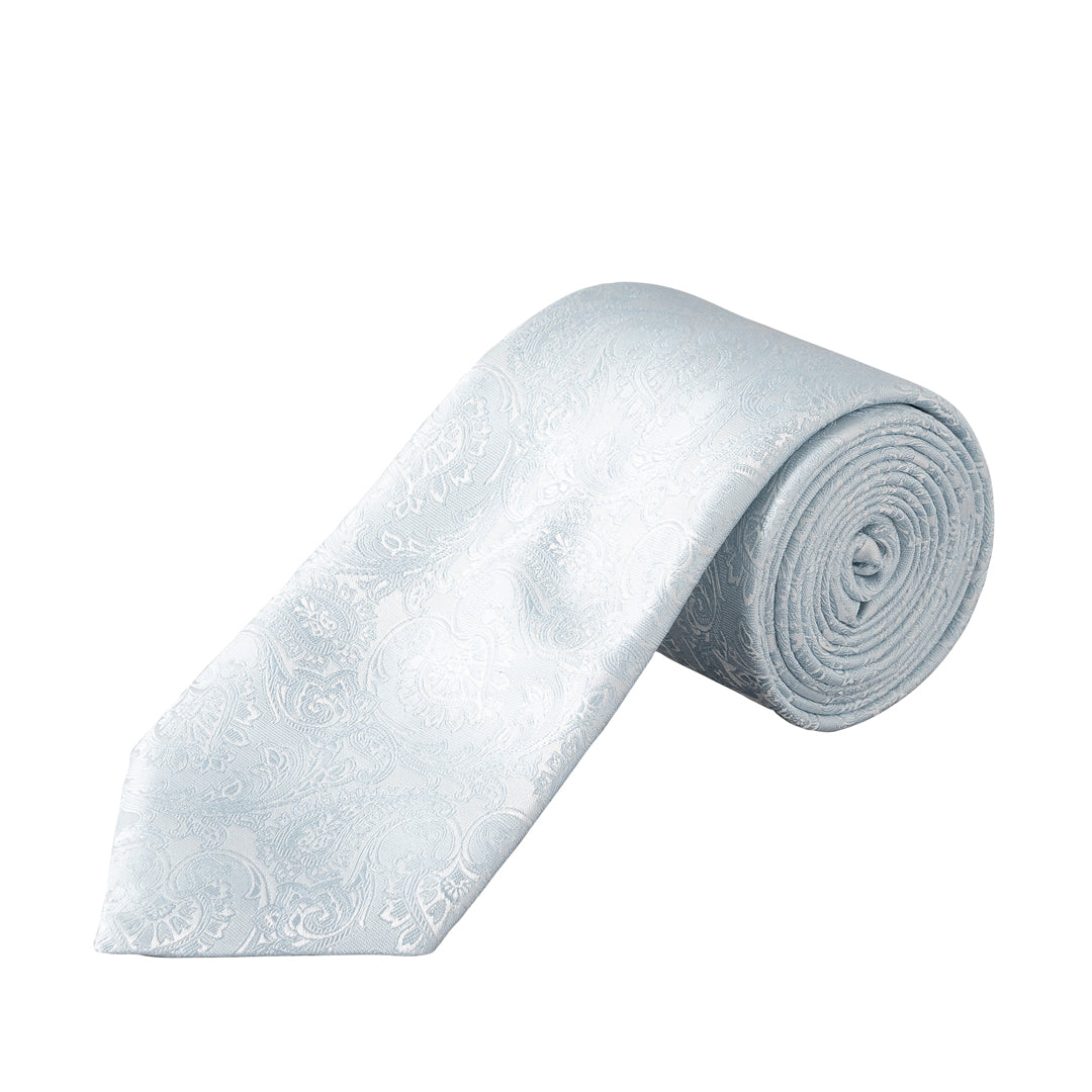 A rolled and laid-flat white silk necktie with a subtle, tonal paisley pattern, shown against a plain white background. Eton Ties available at Sakks Menswear in Southampton.