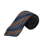 A rolled necktie with a textured woven pattern featuring diagonal stripes of navy blue, brown, and gray on a white background. Eton Ties available at Sakks Menswear in Southampton.