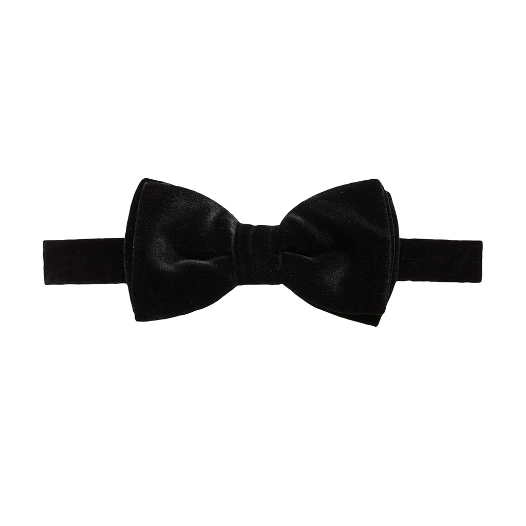 A classic black bow tie made of velvet fabric, presented flat against a solid white background. Bow Ties available at Sakks Menswear in Southampton.