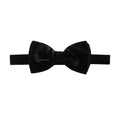 A classic black bow tie made of velvet fabric, presented flat against a solid white background. Bow Ties available at Sakks Menswear in Southampton.