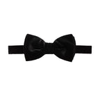 A classic black bow tie made of velvet fabric, presented flat against a solid white background. Bow Ties available at Sakks Menswear in Southampton.