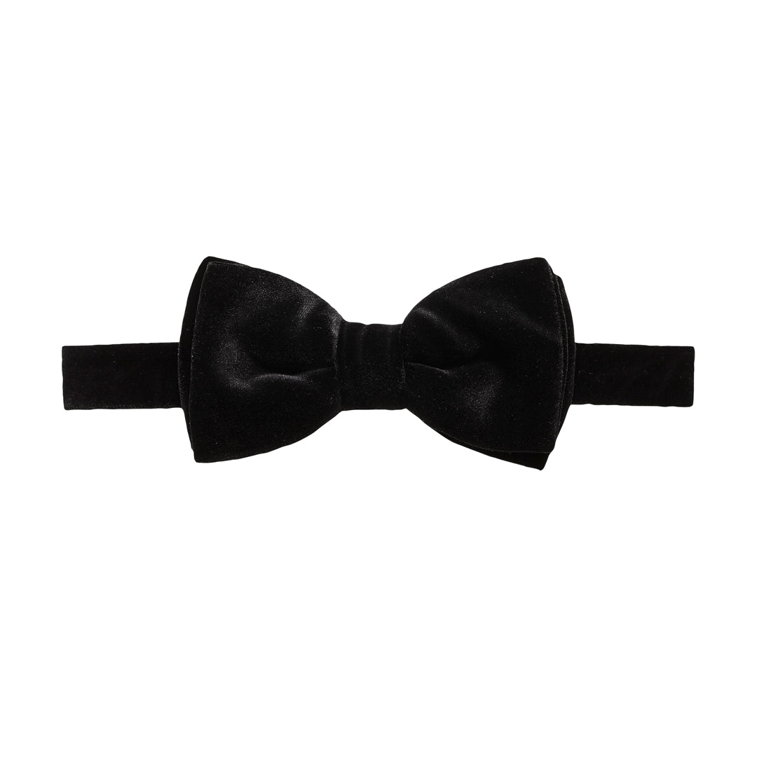 A classic black bow tie made of velvet fabric, presented flat against a solid white background. Bow Ties available at Sakks Menswear in Southampton.