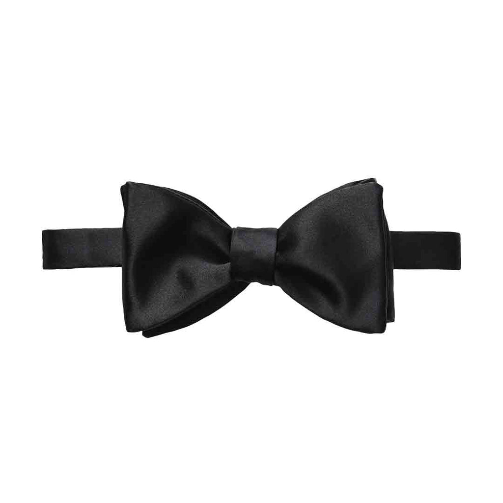 A classic pre-tied black satin bow tie displayed horizontally against a solid white background. Eton Bow Ties available at Sakks Menswear in Southampton.