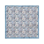 A square cotton pocket square with a classic paisley pattern in shades of blue, beige, and brown, finished with a solid light blue border. The brand name 'TON' is printed in the top-left corner. Eton Pocket Square available at Sakks Menswear in Southampton.
