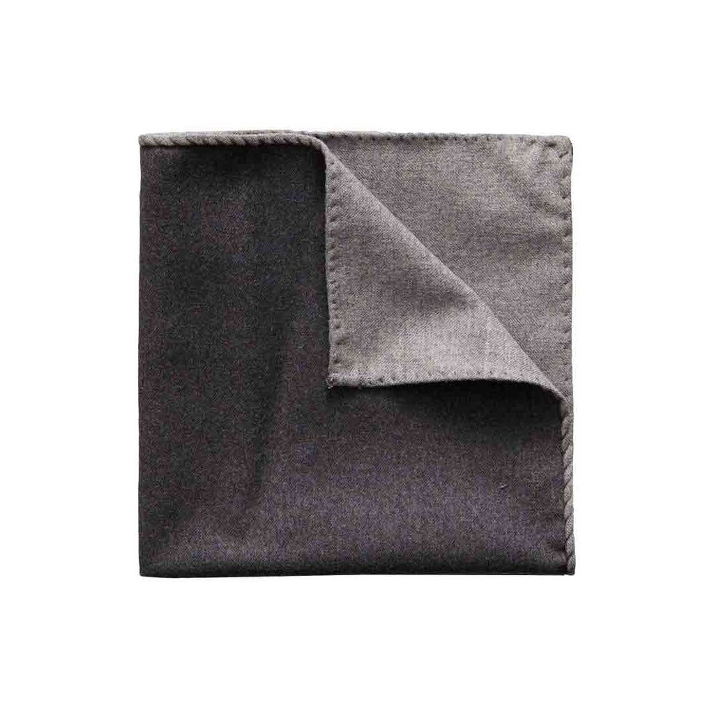 A folded dark gray pocket square with a lighter gray underside and stitched border, shown on a plain white background. Eton Pocket Square available at Sakks Menswear in Southampton.