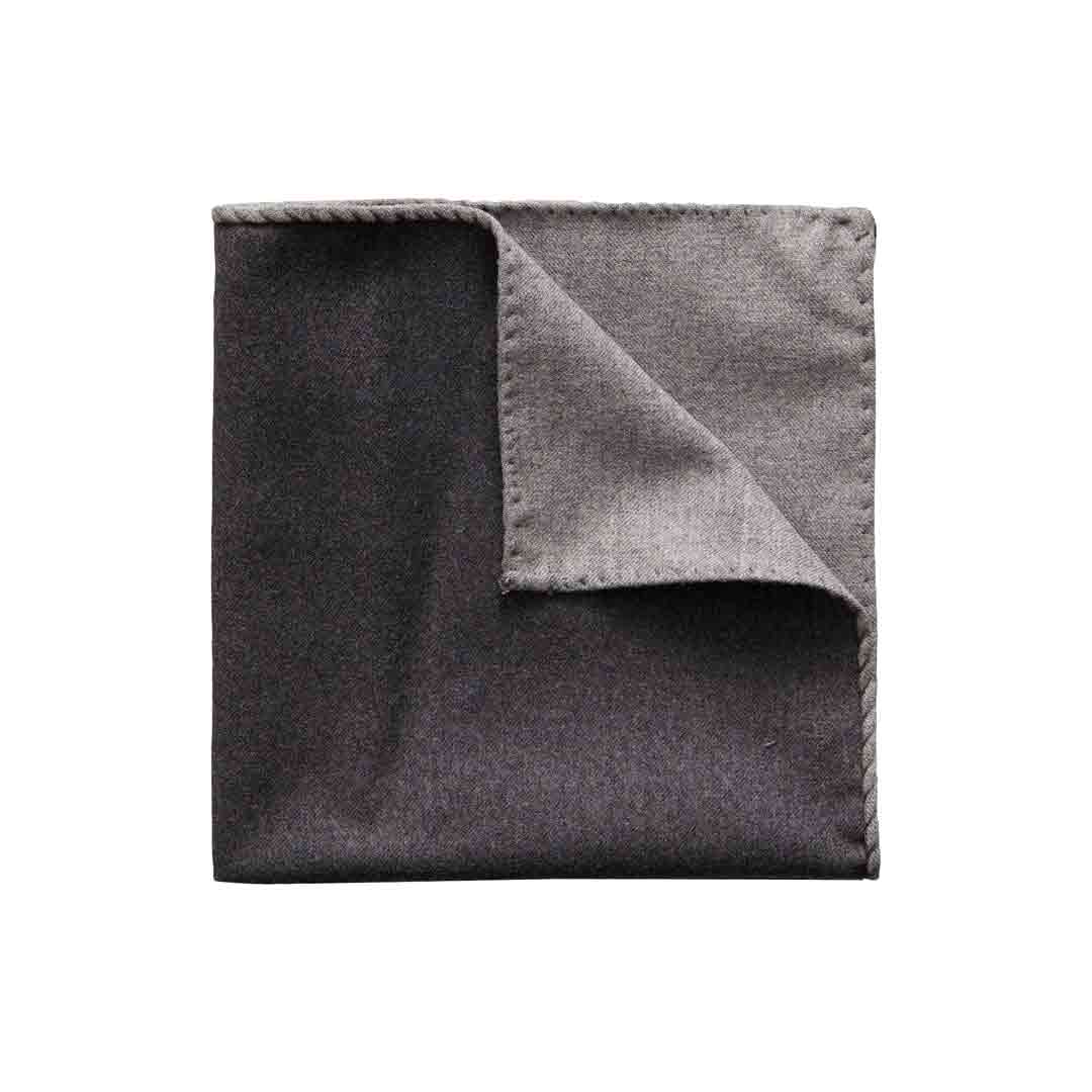 A folded dark gray pocket square with a lighter gray underside and stitched border, shown on a plain white background. Eton Pocket Square available at Sakks Menswear in Southampton.