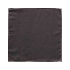 A square dark charcoal gray pocket square with a stitched border and the brand name 'ETON' printed in small white letters in the top-left corner, shown on a plain white background. Eton Pocket Square available at Sakks Menswear in Southampton.