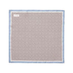 A square silk scarf with a repeating geometric pattern in brown and beige, finished with a light blue border, shown flat against a white background. Eton Pocket Square available at Sakks Menswear in Southampton.