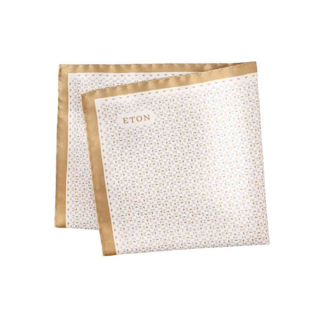 Two folded napkins with gold trim and 'ETON' branding on a white background. Eton Pocket Square available at Sakks Menswear in Southampton.