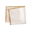 Two folded napkins with gold trim and 'ETON' branding on a white background. Eton Pocket Square available at Sakks Menswear in Southampton.