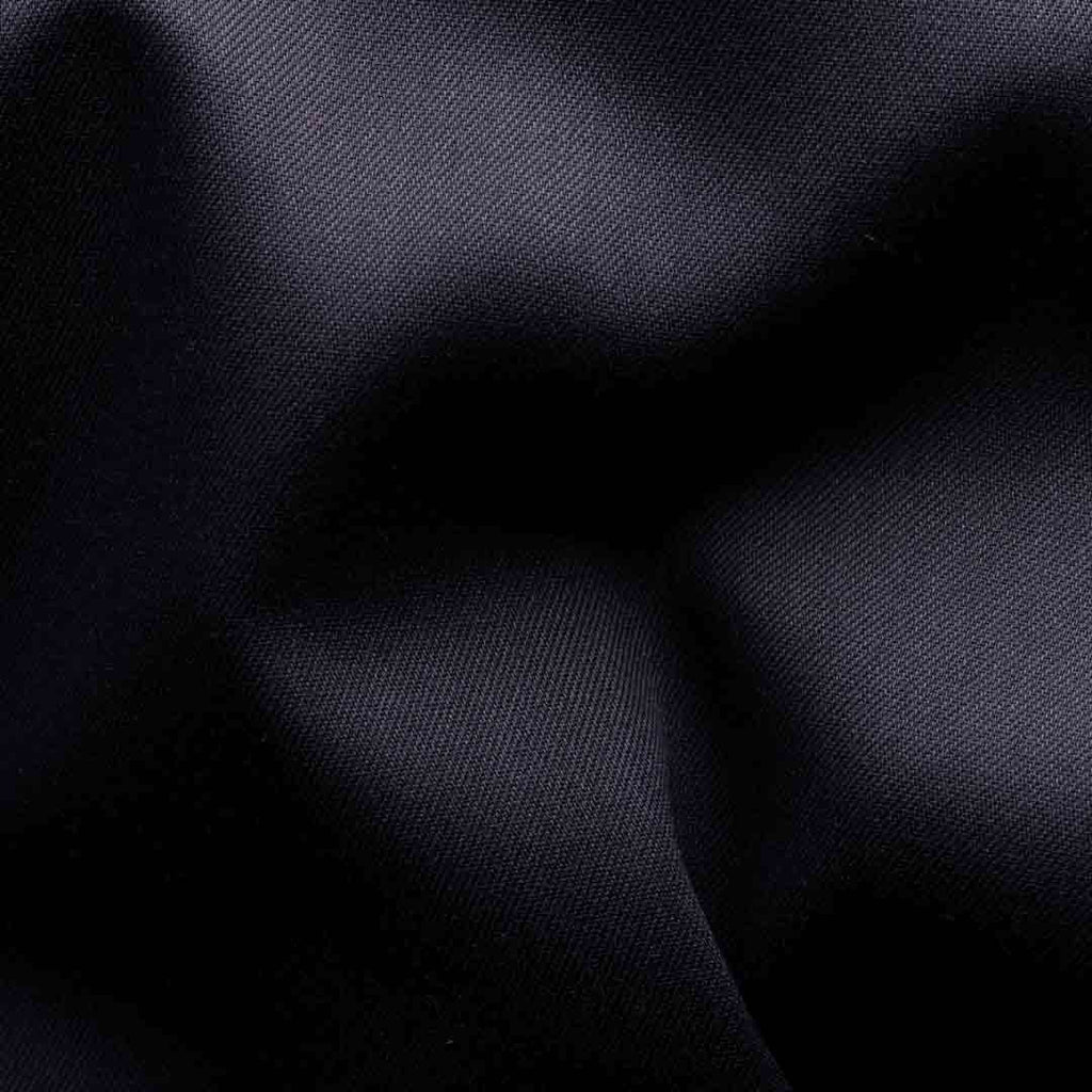 A close-up of dark navy blue fabric with soft folds and a subtle woven texture. Eton Shirt available at Sakks Menswear in Southampton.