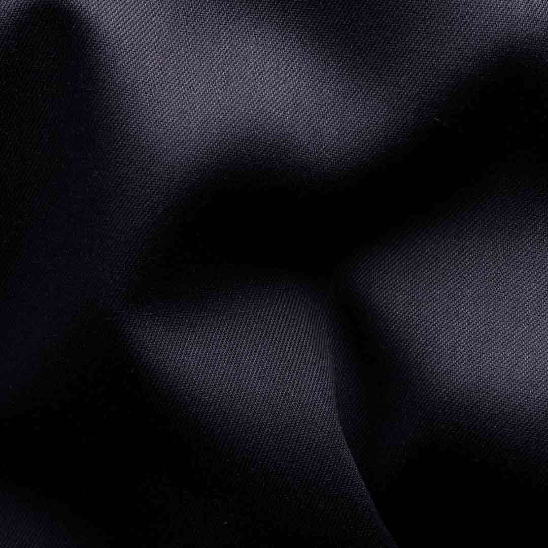 A close-up of dark navy blue fabric with soft folds and a subtle woven texture. Eton Shirt available at Sakks Menswear in Southampton.