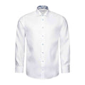 A white long-sleeve dress shirt with a pointed collar, button-down front, and a blue paisley patterned inner collar, shown on a plain white background. Eton Shirt available at Sakks Menswear in Southampton.