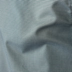 Close-up of a fine micro-check fabric pattern in light green and white, showing soft folds and texture.  Eton Shirts available at Sakks Menswear in Southampton.