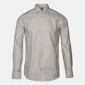 A light beige shirt with brown buttons in front of a light grey background. Eton shirts available at Sakks Menswear in Southampton.