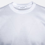 Close-up of a white crewneck t-shirt by The Gran Sasso, showing the inner neck label and the soft, textured fabric. Gran Sasso T-Shirt available at Sakks Menswear in Southampton.