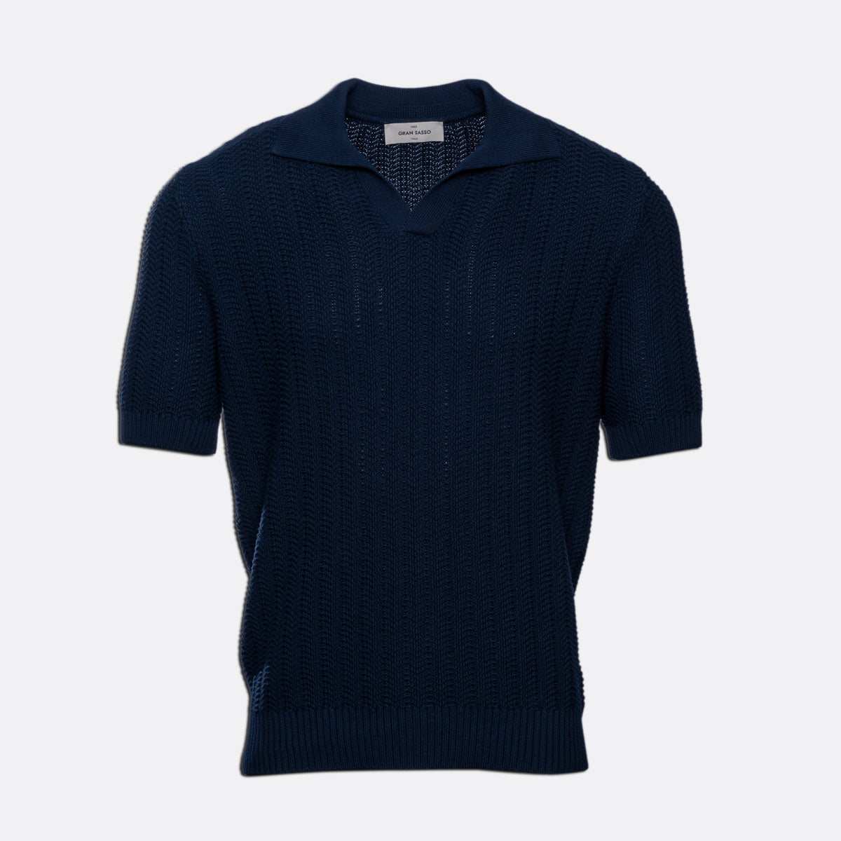 A dark navy blue short-sleeve knit polo sweater with a textured openwork pattern, displayed on a clean light grey background. Gran Sasso Polo available at Sakks Menswear in Southampton.