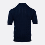 A dark navy blue short-sleeve knit polo shirt with a textured cable pattern, shown from the back against a light grey background. Gran Sasso Polo available at Sakks Menswear in Southampton.