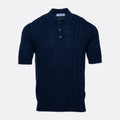 A dark navy blue short-sleeve knit polo shirt with a cable pattern, shown against a light grey background. Gran Sasso Polo available at Sakks Menswear in Southampton.